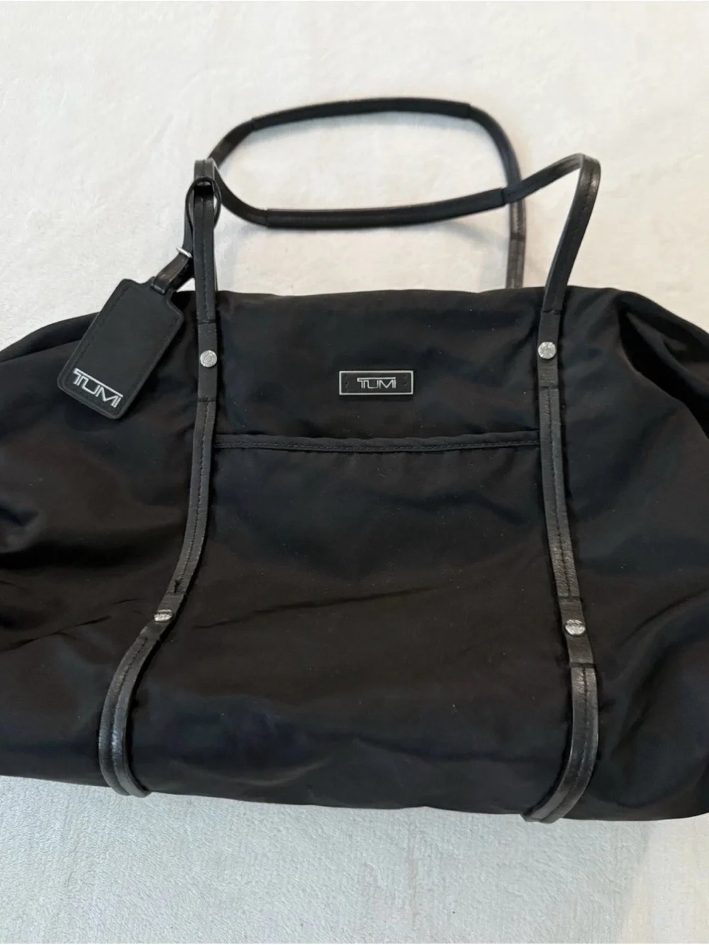 Tumi Voyageur Q-Tote Bag in black nylon with leather trim